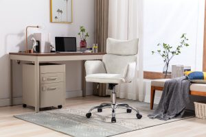 A Swivel Chair Near Table with Laptop