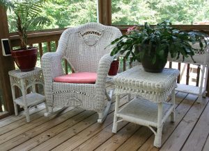 wicker rocking chair, porch, white table