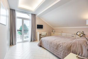 White bedroom with cozy bed